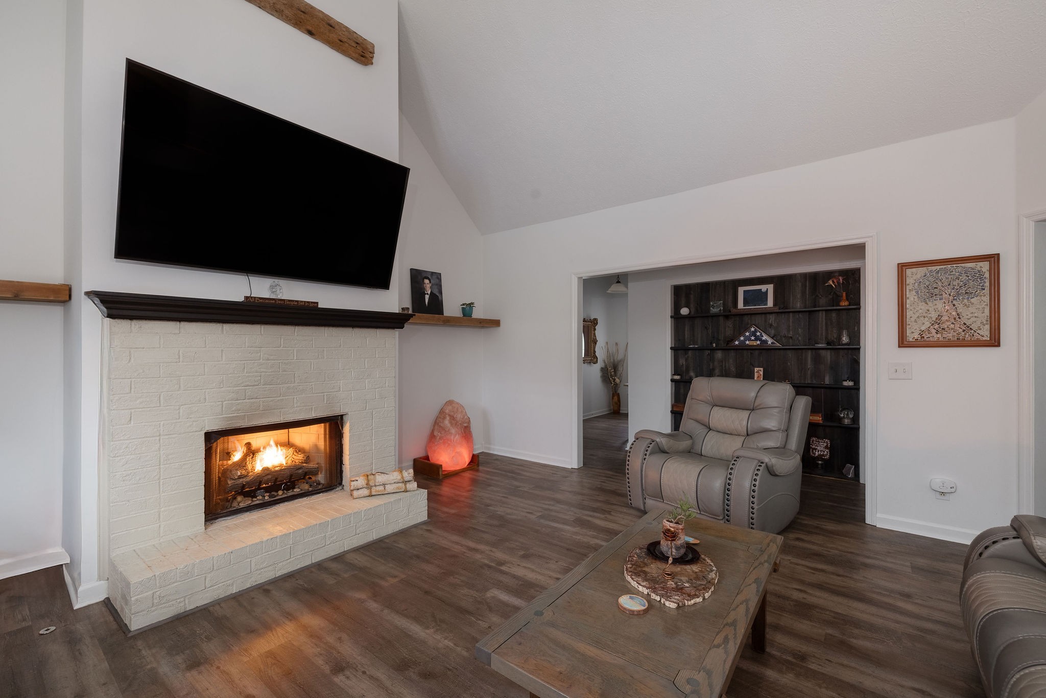 95 Old 25 Loop Hartsville, TN 37074 - Photo 7 of 99 a living room with furniture a flat screen tv and a fireplace