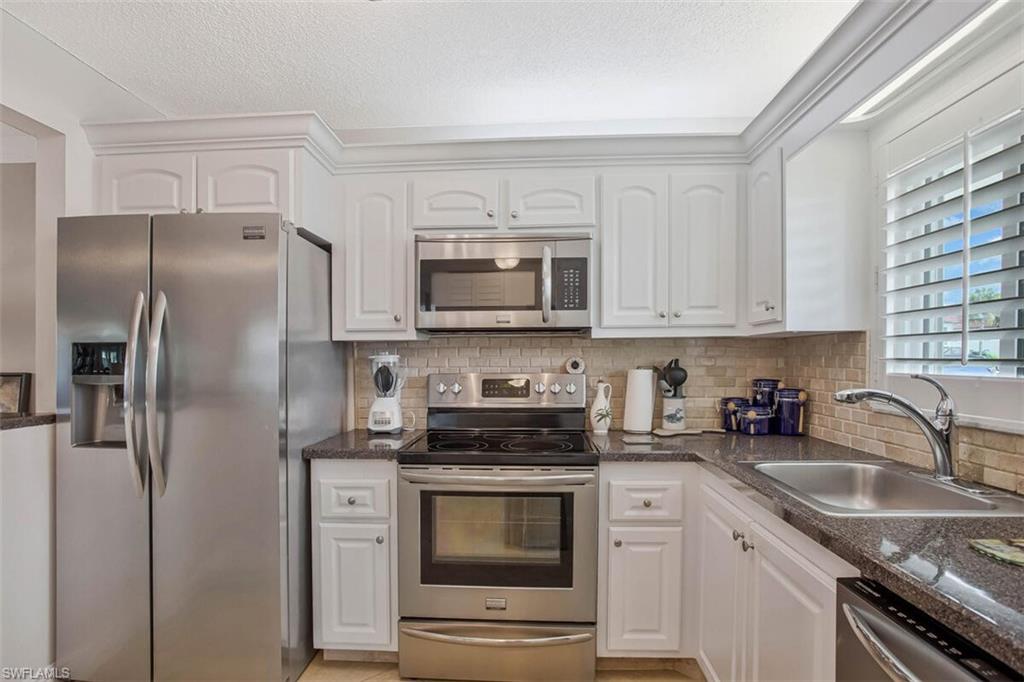 4318 27th Court Southwest, Unit 101 Naples, FL 34116 - Photo 16 of 32 sunny and bright everything you need is here