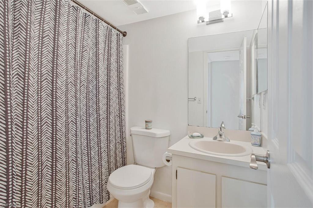 4318 27th Court Southwest, Unit 101 Naples, FL 34116 - Photo 21 of 32 guest bath with tub and shower combo