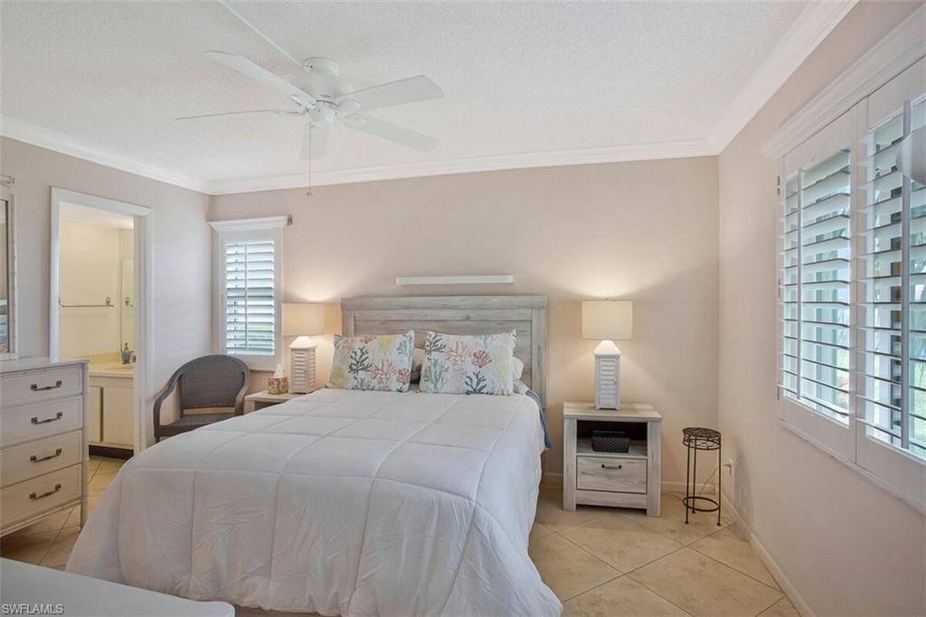 4318 27th Court Southwest, Unit 101 Naples, FL 34116 - Photo 26 of 32 with on suite and walk in closet
