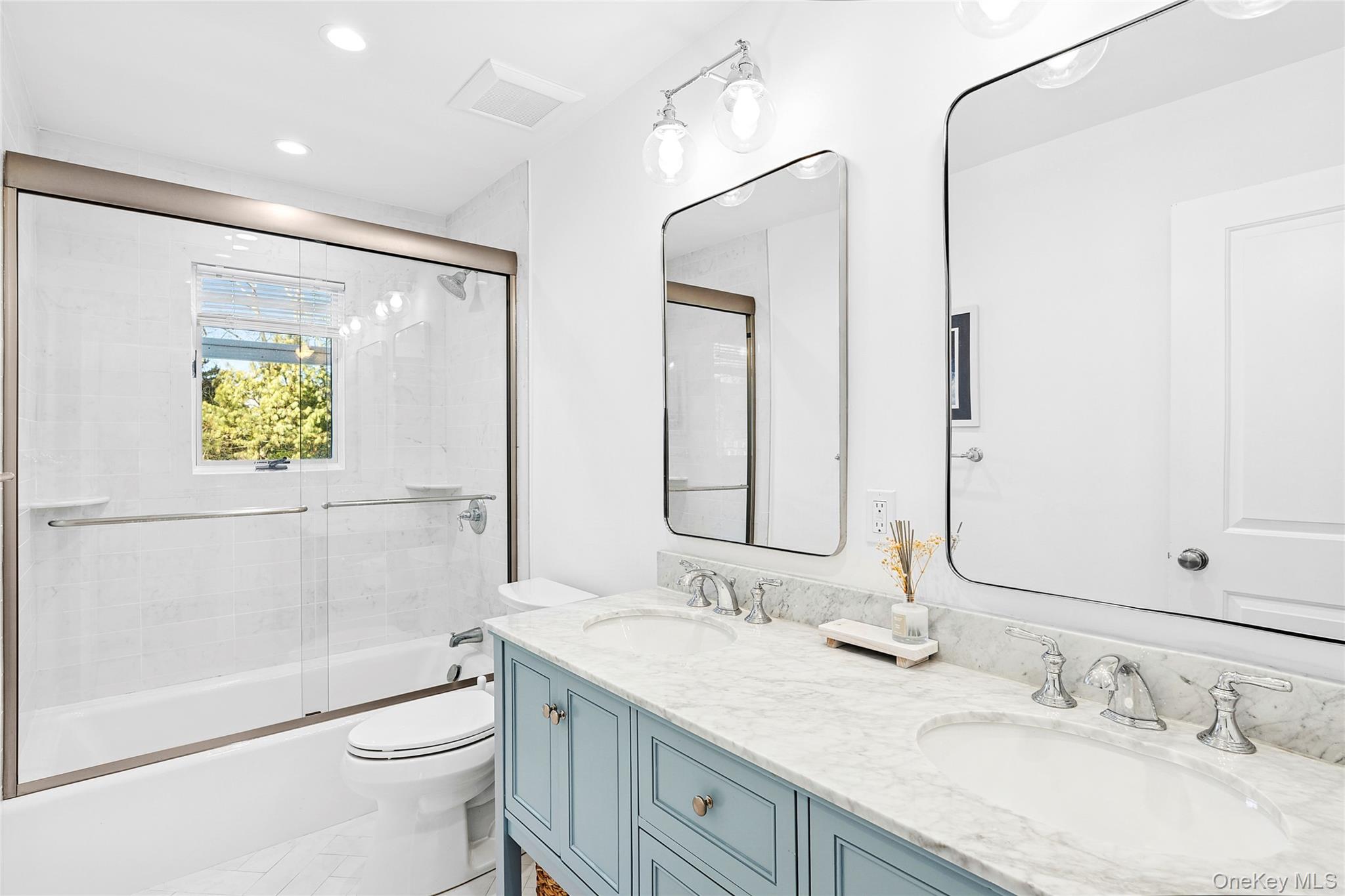 47 Bridle Path Remsenburg, NY 11960 - Photo 12 of 20 a bathroom with a granite countertop sink toilet and shower
