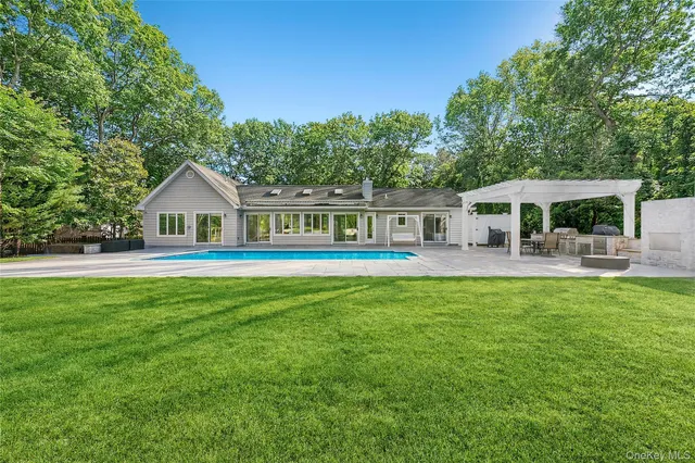 a front view of house with yard and seating area