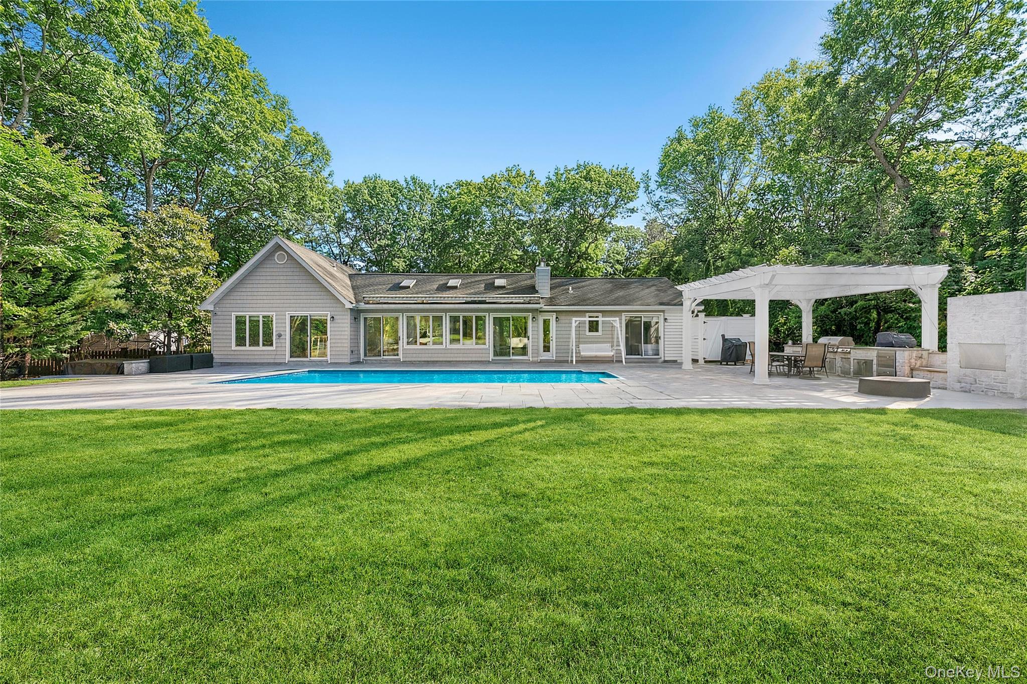 47 Bridle Path Remsenburg, NY 11960 - Photo 18 of 20 a front view of house with yard and seating area