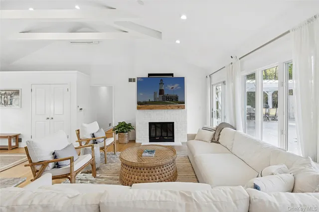a living room with furniture fireplace and a flat screen tv