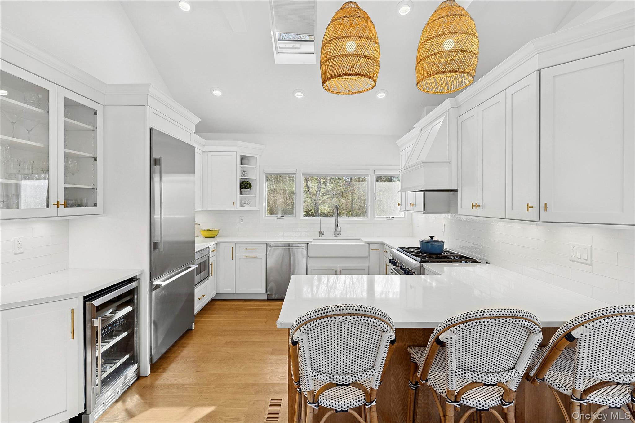 47 Bridle Path Remsenburg, NY 11960 - Photo 6 of 20 a kitchen with stainless steel appliances granite countertop a table chairs and a stove