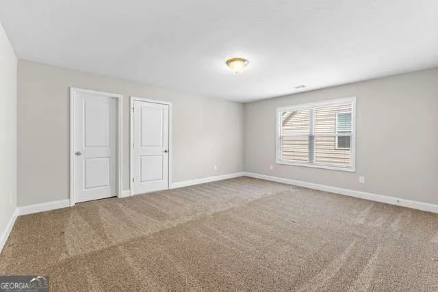 an empty room with windows