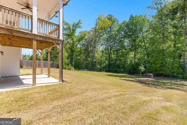 a view of house with outdoor space and river