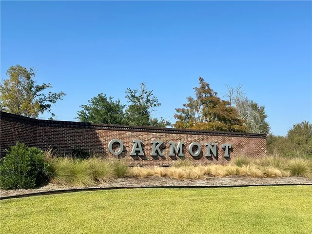 a view of swimming pool with a garden and covered with wooden fence