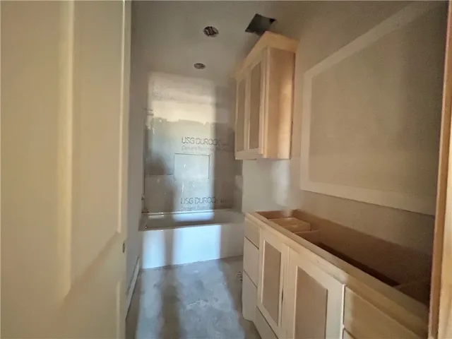 a kitchen with a refrigerator and a sink