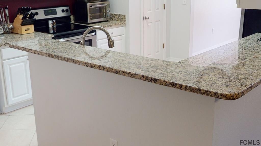 56 Karat Path Palm Coast, FL 32164 - Photo 12 of 44 BREAKFAST BAR, TOO!