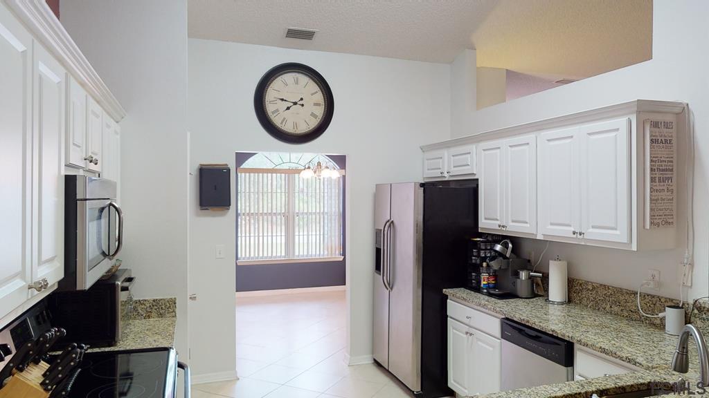 56 Karat Path Palm Coast, FL 32164 - Photo 27 of 44 WELL-APPOINTED KITCHEN!