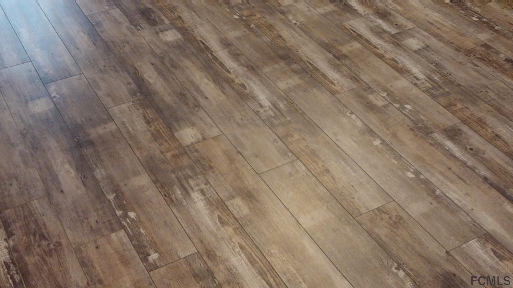 56 Karat Path Palm Coast, FL 32164 - Photo 7 of 44 EXQUISITE WOOD LAMINATE FLOORING!