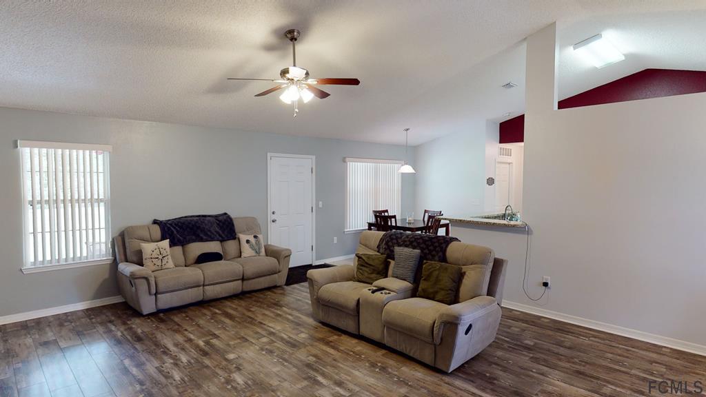 56 Karat Path Palm Coast, FL 32164 - Photo 9 of 44 GORGEOUS WOOD LAMINATE FLOORING!