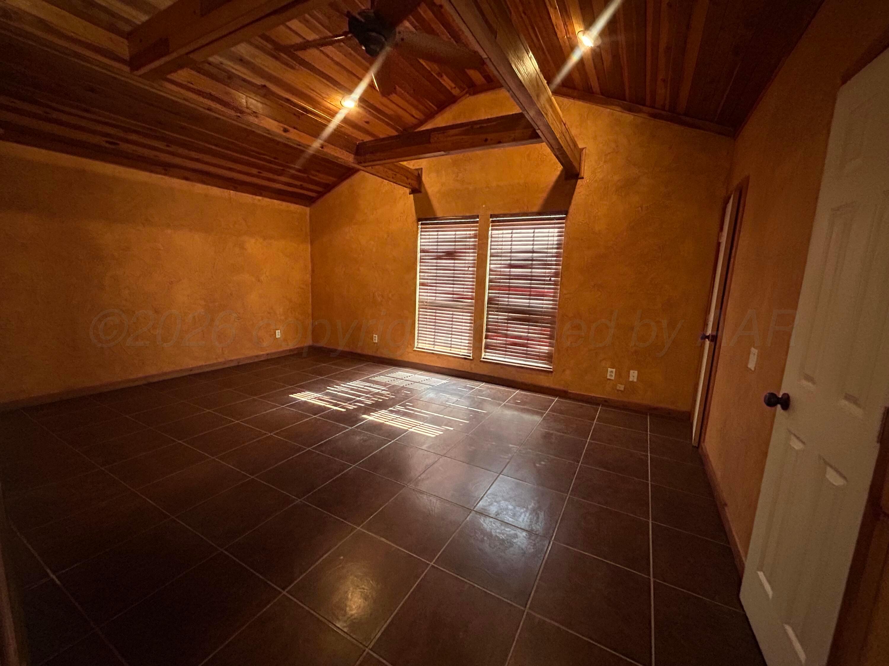 923 Elmore Street Borger, TX 79007 - Photo 10 of 18 a view of empty room with windows