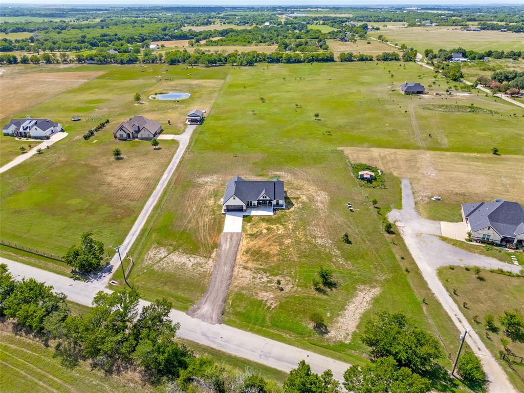 3150 Crisp Road Ennis, TX 75119 - Photo 29 of 30 Expansive green acreage with a prominent central residence