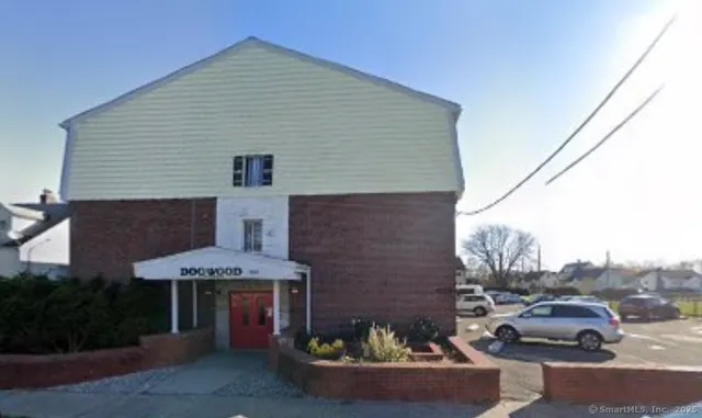 a front view of a house with sitting area
