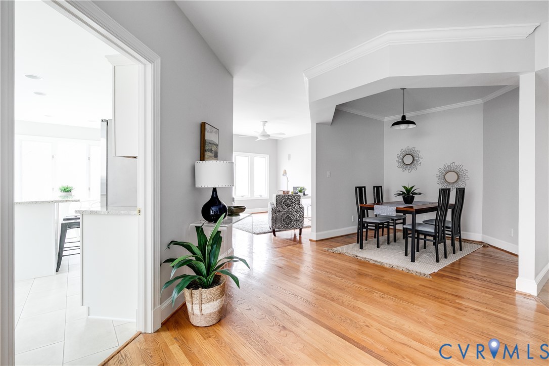 3207 Stony Point Road, Unit C Richmond, VA 23235 - Photo 11 of 40 a dining room with furniture potted plants and wooden floor