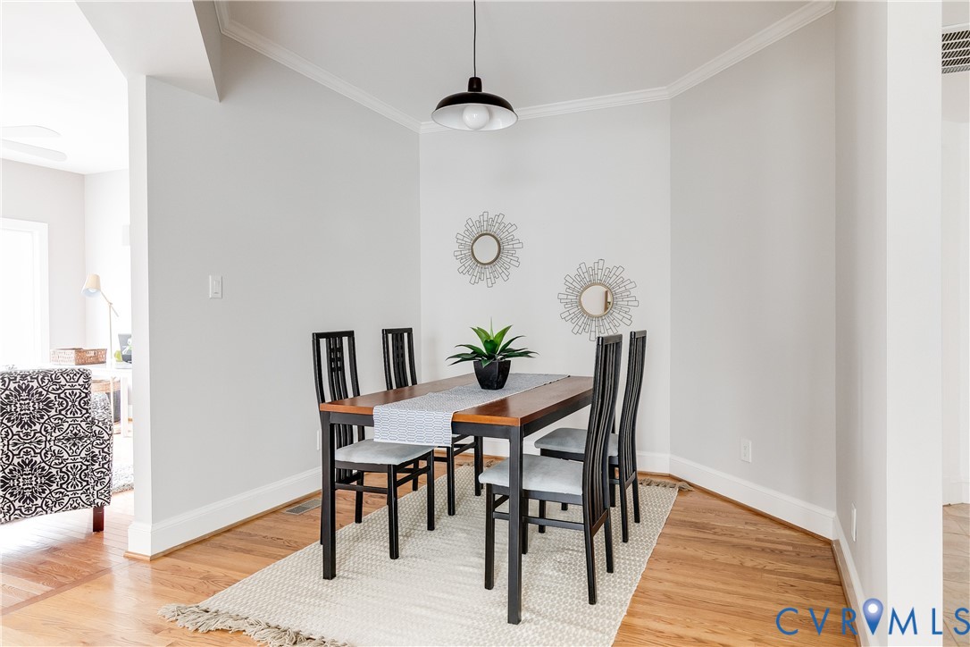 3207 Stony Point Road, Unit C Richmond, VA 23235 - Photo 12 of 40 a view of a dining room with furniture and wooden floor