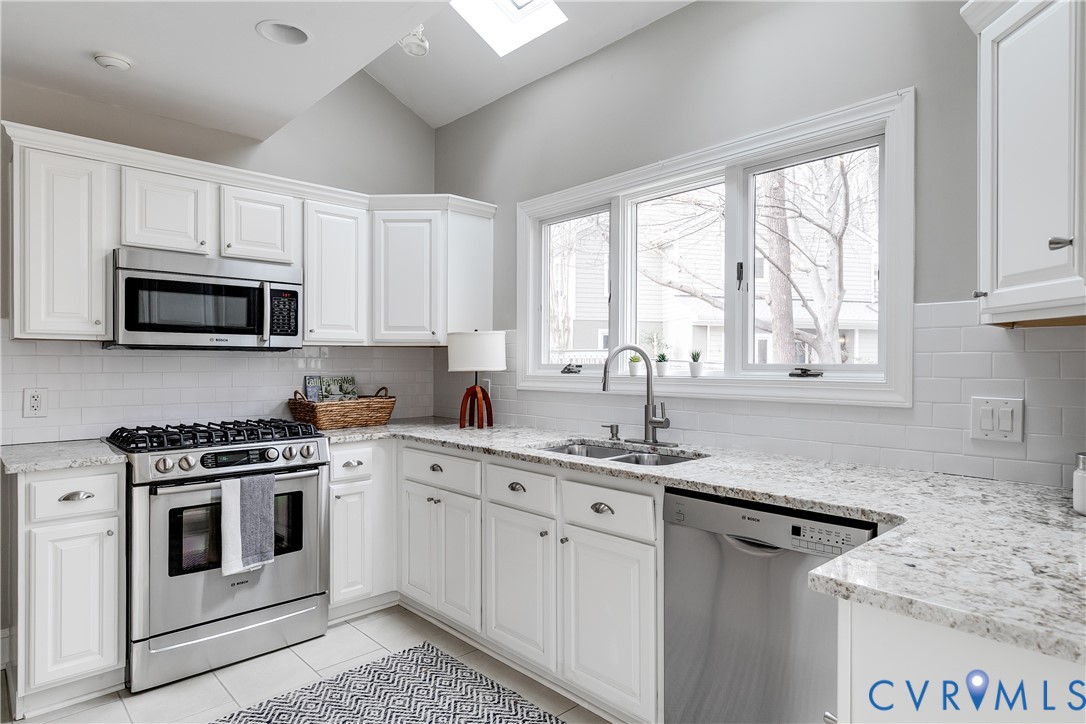 3207 Stony Point Road, Unit C Richmond, VA 23235 - Photo 21 of 40 a kitchen with appliances cabinets a sink and a window