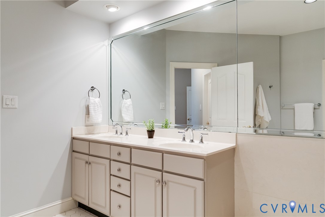 3207 Stony Point Road, Unit C Richmond, VA 23235 - Photo 32 of 40 a bathroom with a double vanity sink and a mirror