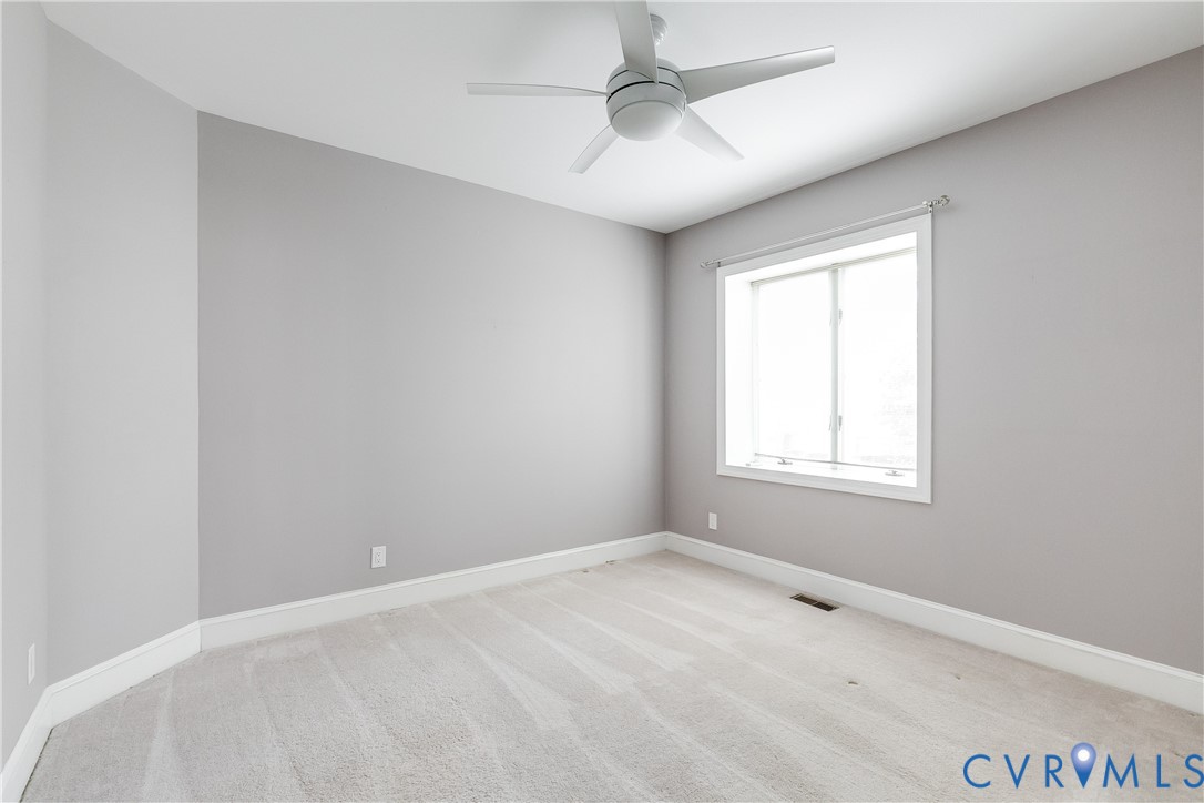 3207 Stony Point Road, Unit C Richmond, VA 23235 - Photo 33 of 40 an empty room with a window and a fan