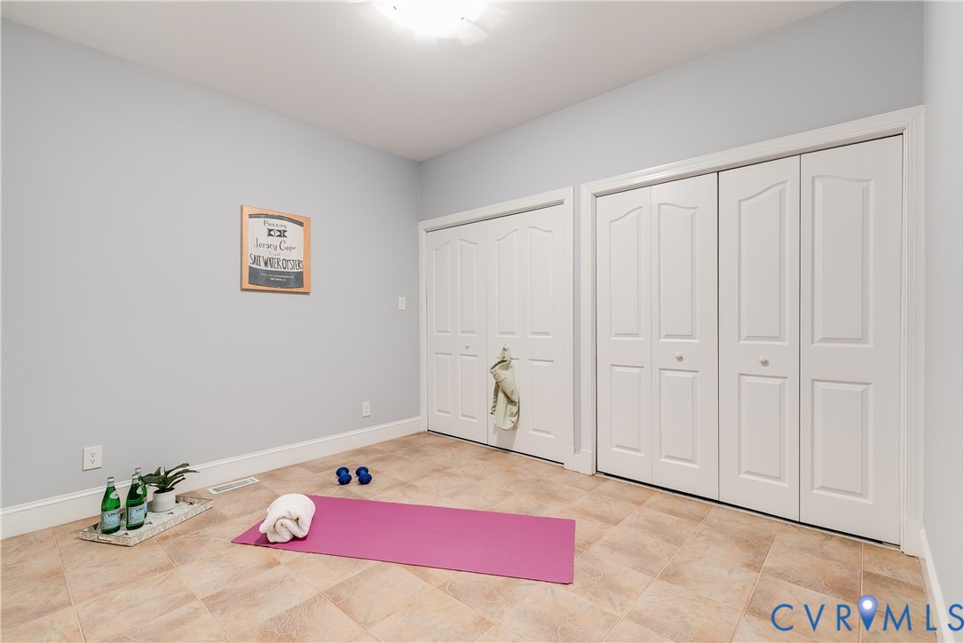 3207 Stony Point Road, Unit C Richmond, VA 23235 - Photo 36 of 40 a bedroom with a bed and a painting on the wall