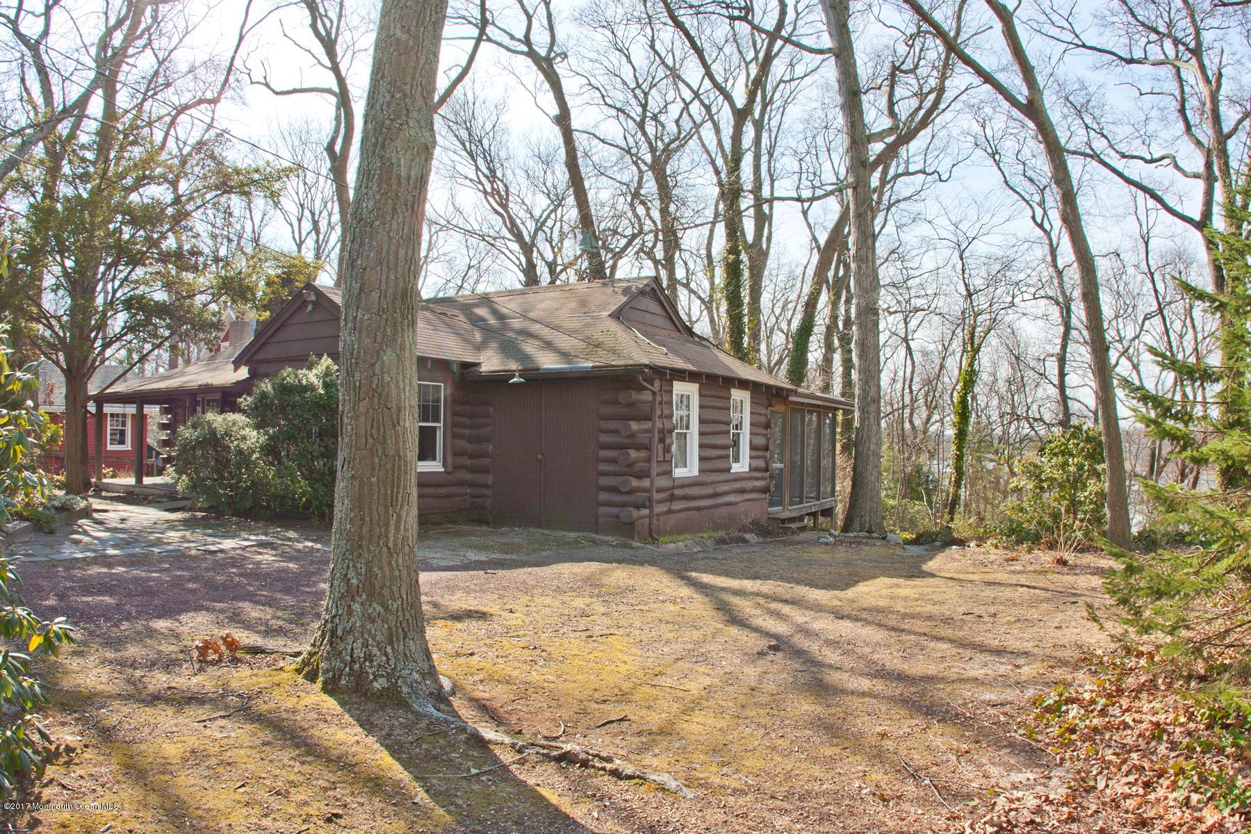 626 South Riverside Drive Neptune Township, NJ 07753 - Photo 25 of 32 a view of a yard with a tree in the yard
