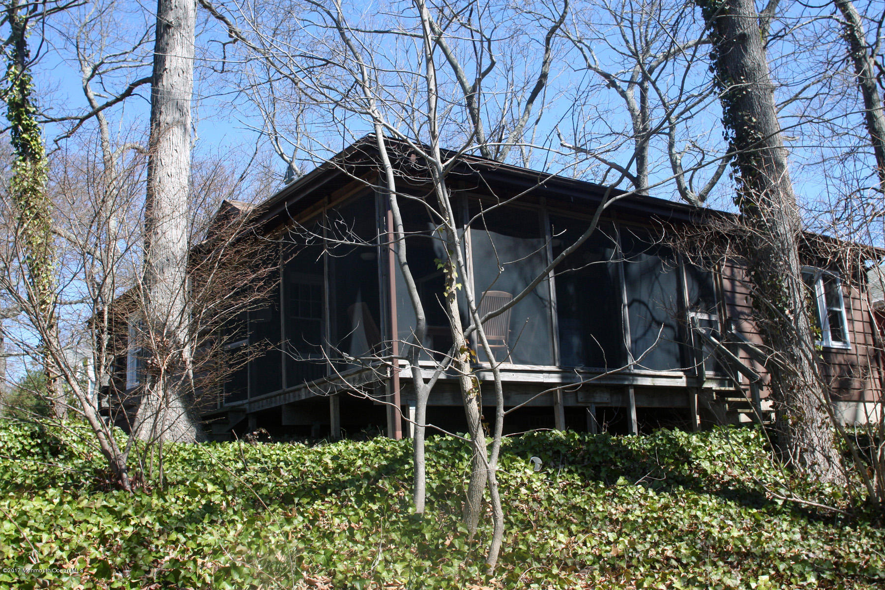 626 South Riverside Drive Neptune Township, NJ 07753 - Photo 27 of 32 front view of a house with a small yard