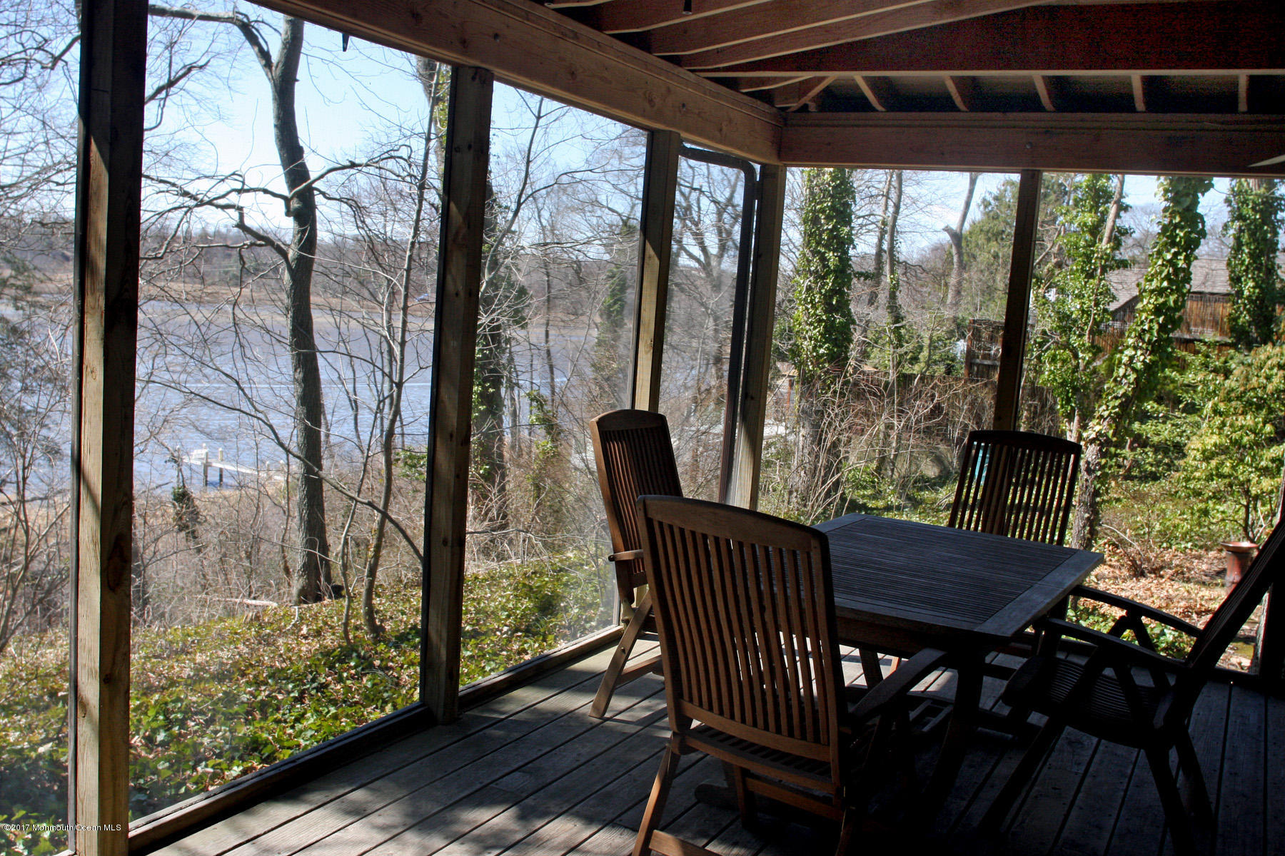 626 South Riverside Drive Neptune Township, NJ 07753 - Photo 4 of 32 a view of a porch with furniture and wooden floor