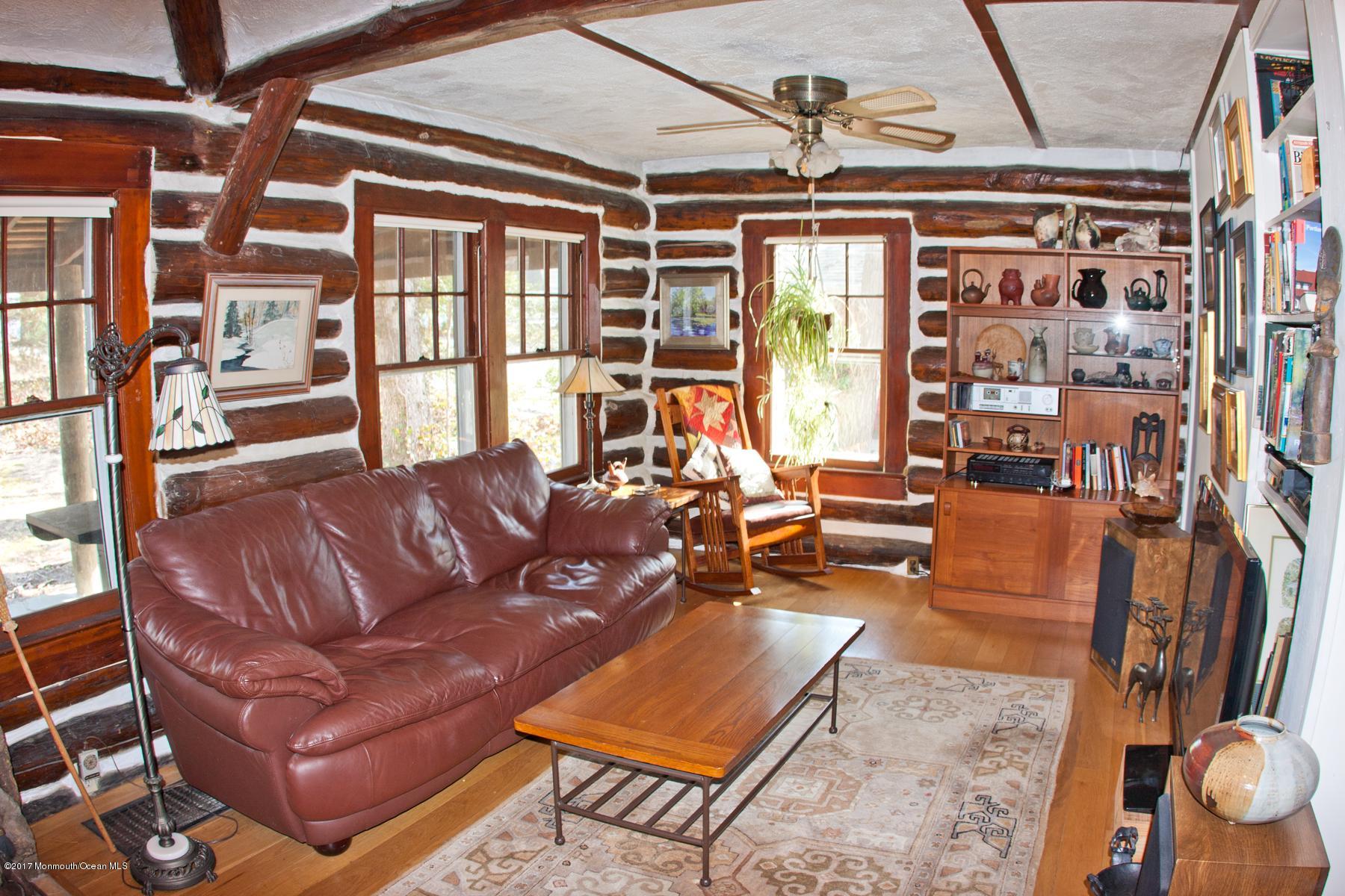 626 South Riverside Drive Neptune Township, NJ 07753 - Photo 8 of 32 a living room with furniture a rug and a large window