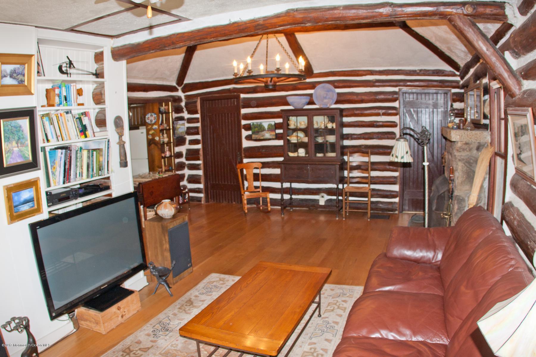 626 South Riverside Drive Neptune Township, NJ 07753 - Photo 9 of 32 a view of a livingroom with furniture and staircase