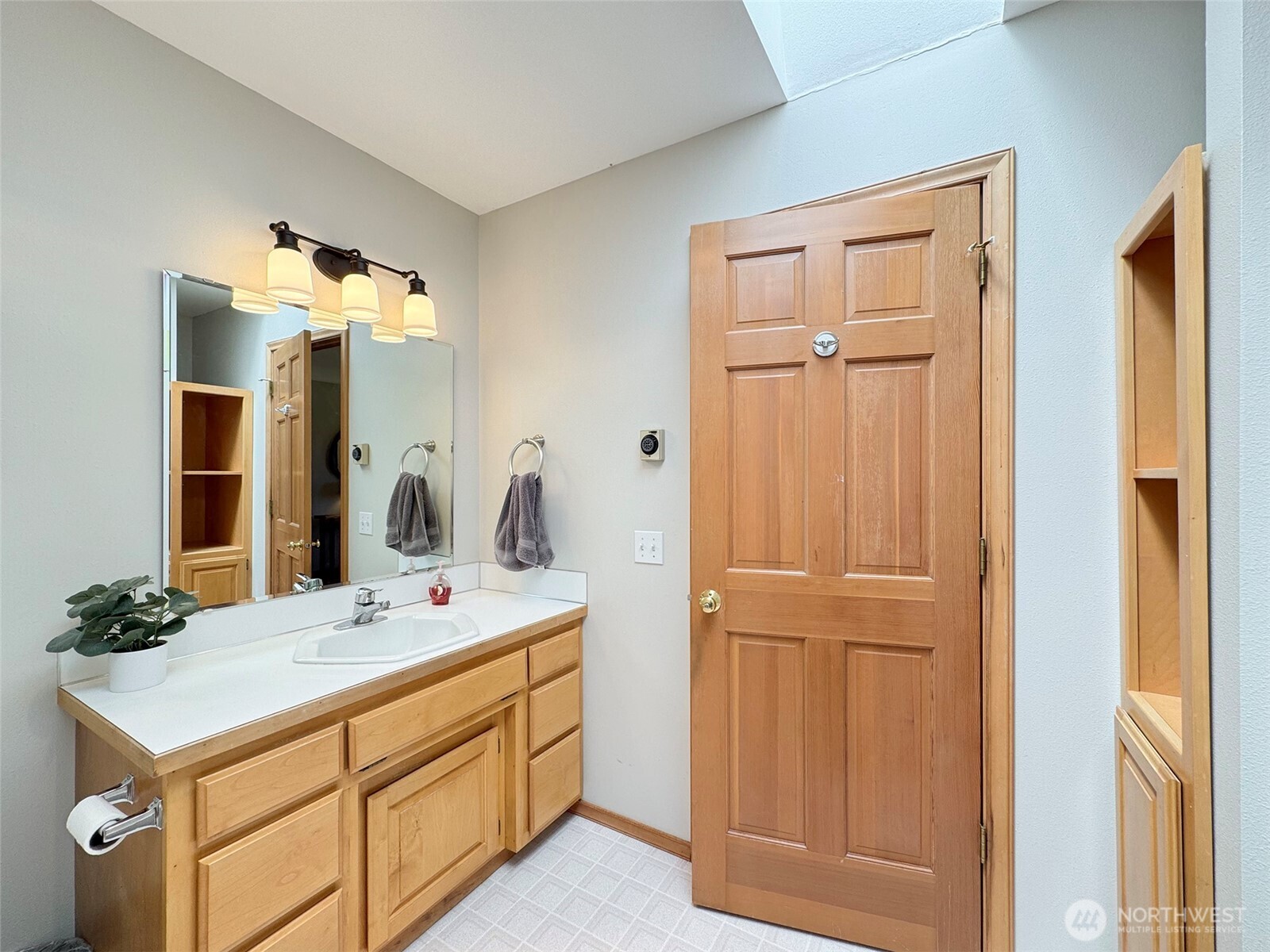 22 East Bedinger Road Sequim, WA 98382 - Photo 27 of 40 a bathroom with a sink vanity and a mirror