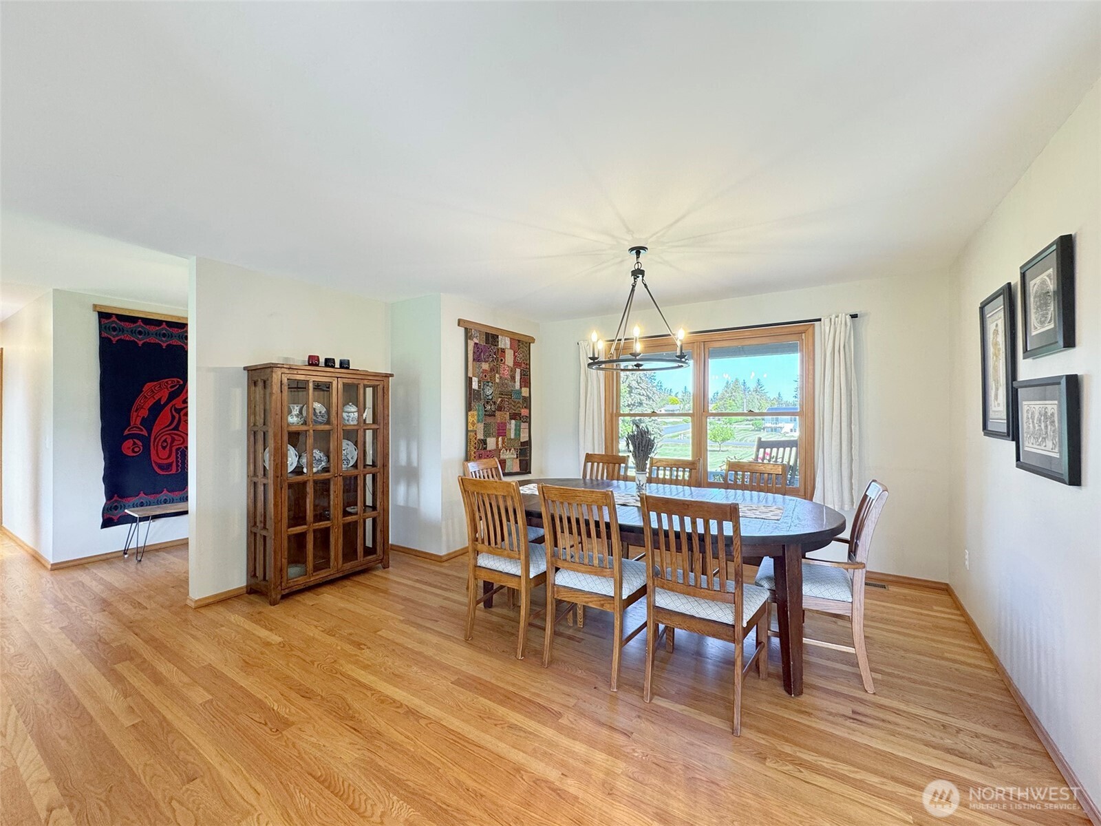 22 East Bedinger Road Sequim, WA 98382 - Photo 10 of 40 a view of a dining room with furniture window and wooden floor