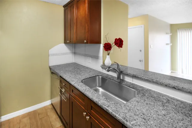 a kitchen with a sink and a window