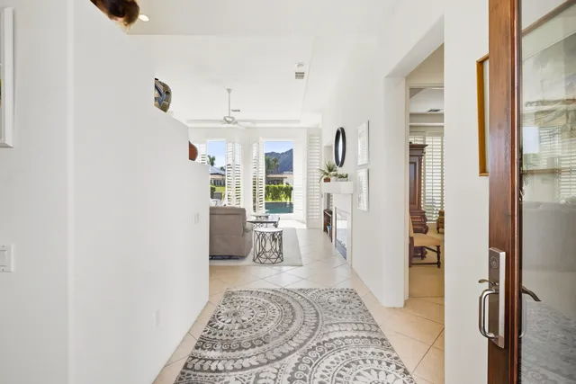 a living room with furniture and a rug