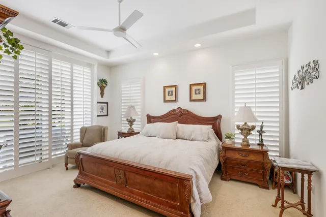 a bedroom with double bed and a window