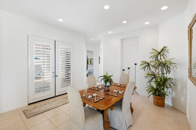 a view of a room with furniture and a potted plant