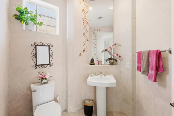 a bathroom with a sink toilet and vanity
