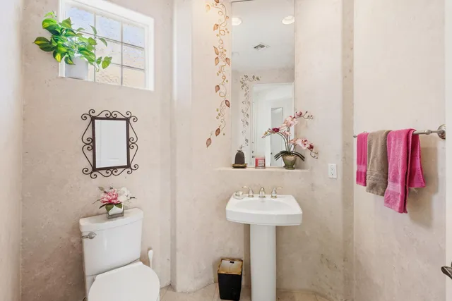 a bathroom with a sink toilet and vanity