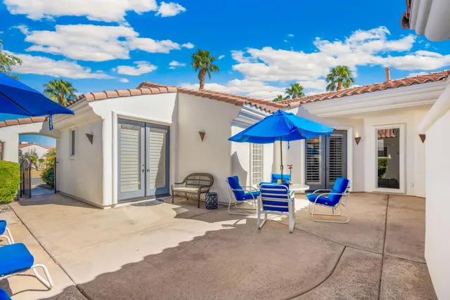 a view of the house with patio outdoor seating space
