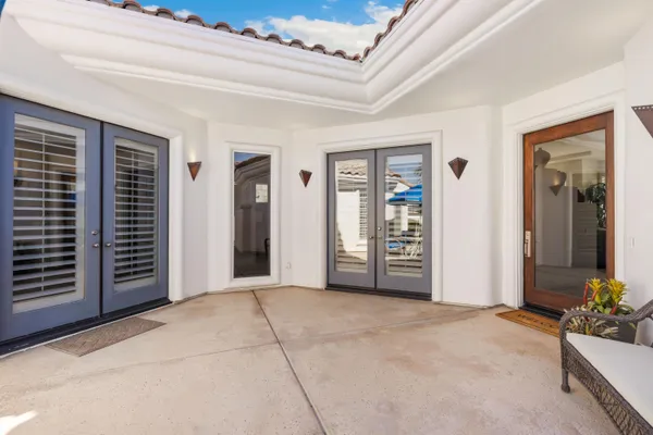 a view of an empty room with closet area