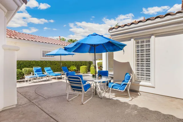 a view of the patio with chairs and a table