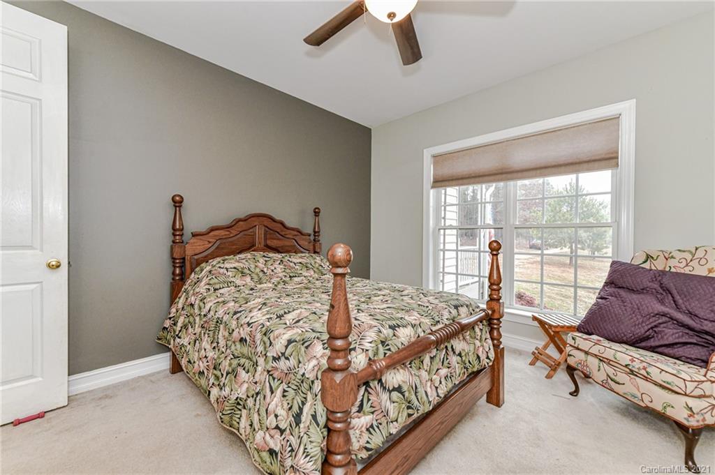 2287 Armenia Road Chester, SC 29706 - Photo 22 of 45 a bed sitting in a bedroom next to a window
