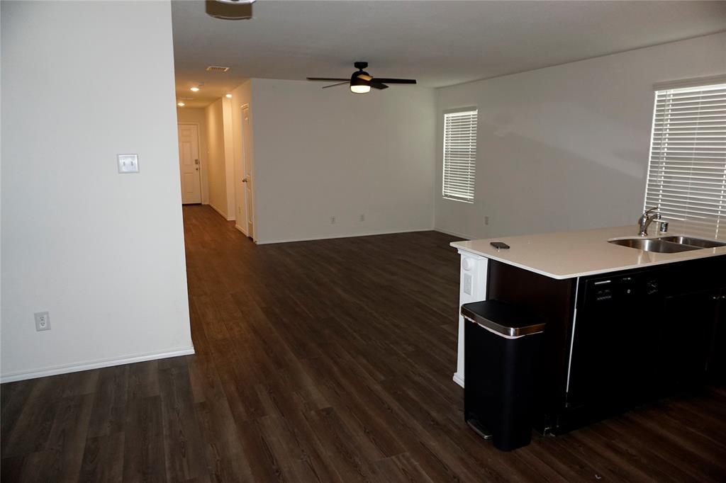 652 Autumnwood Way Princeton, TX 75407 - Photo 40 of 40 wooden floor in an empty room with a window