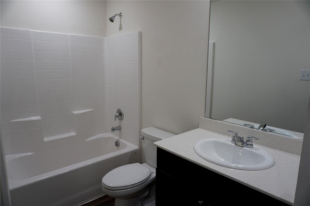 652 Autumnwood Way Princeton, TX 75407 - Photo 3 of 40 a bathroom with a sink toilet vanity and shower