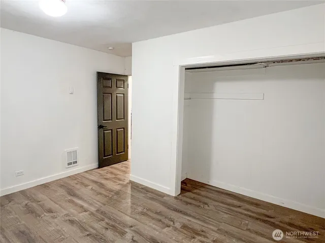 a backyard of a house with wooden floor yard and outdoor seating