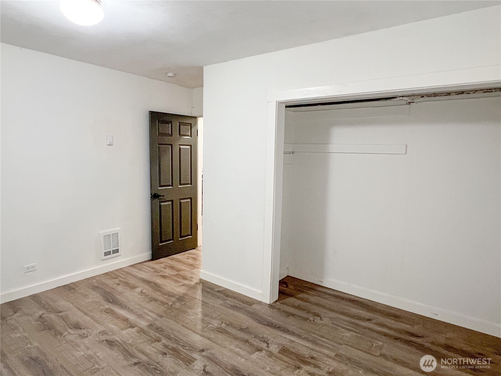 6192 State Rte 20 Port Townsend, WA 98368 - Photo 16 of 25 a view of an empty room with wooden floor and closet