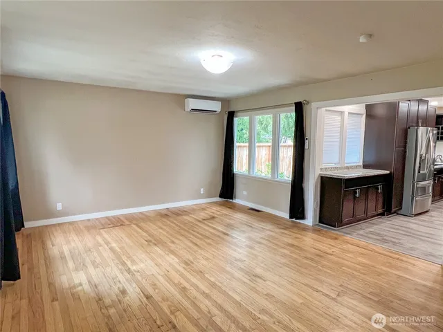 a view of a kitchen with a sink and a window
