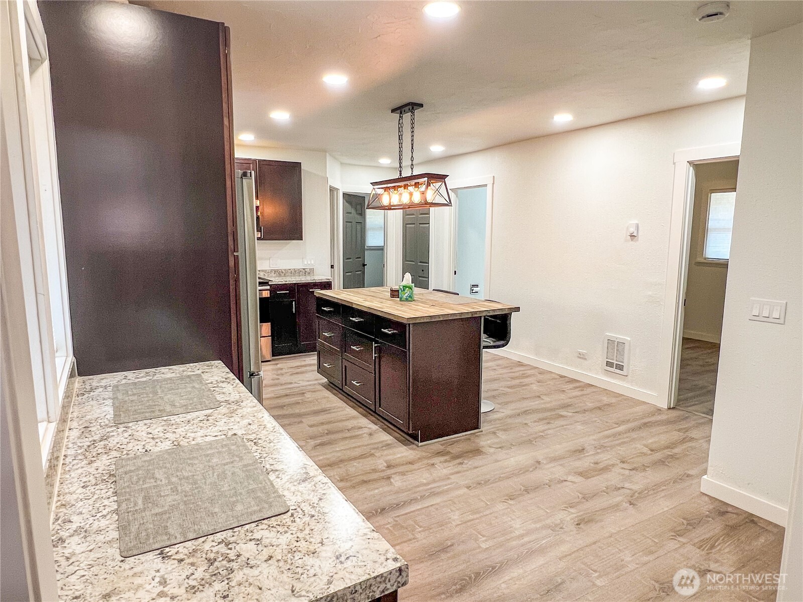 6192 State Rte 20 Port Townsend, WA 98368 - Photo 7 of 25 a kitchen with stainless steel appliances kitchen island granite countertop a refrigerator and a sink