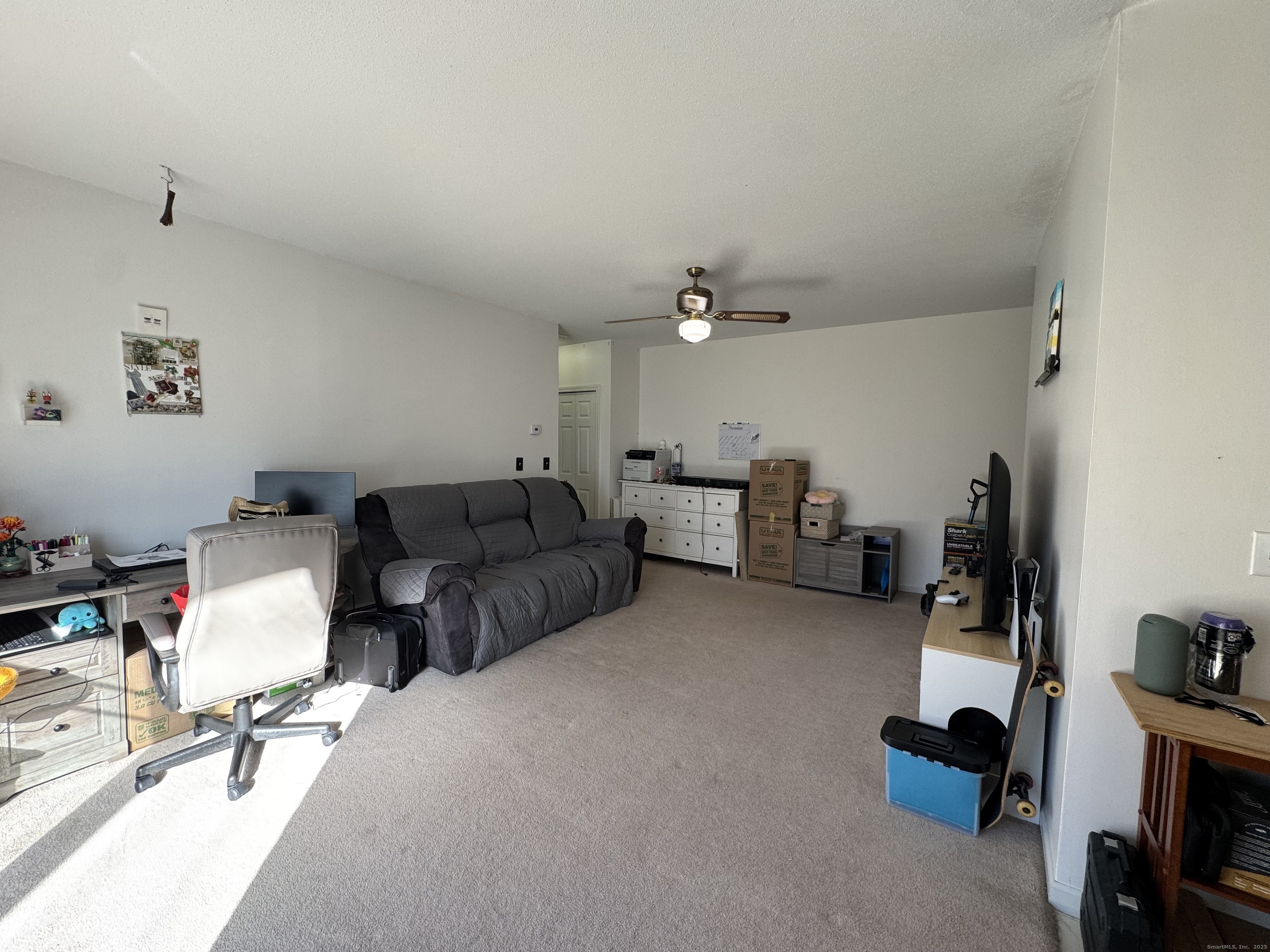 21 Balance Rock Road, Unit 2 Seymour, CT 06483 - Photo 5 of 10 a living room with furniture and a gym equipment